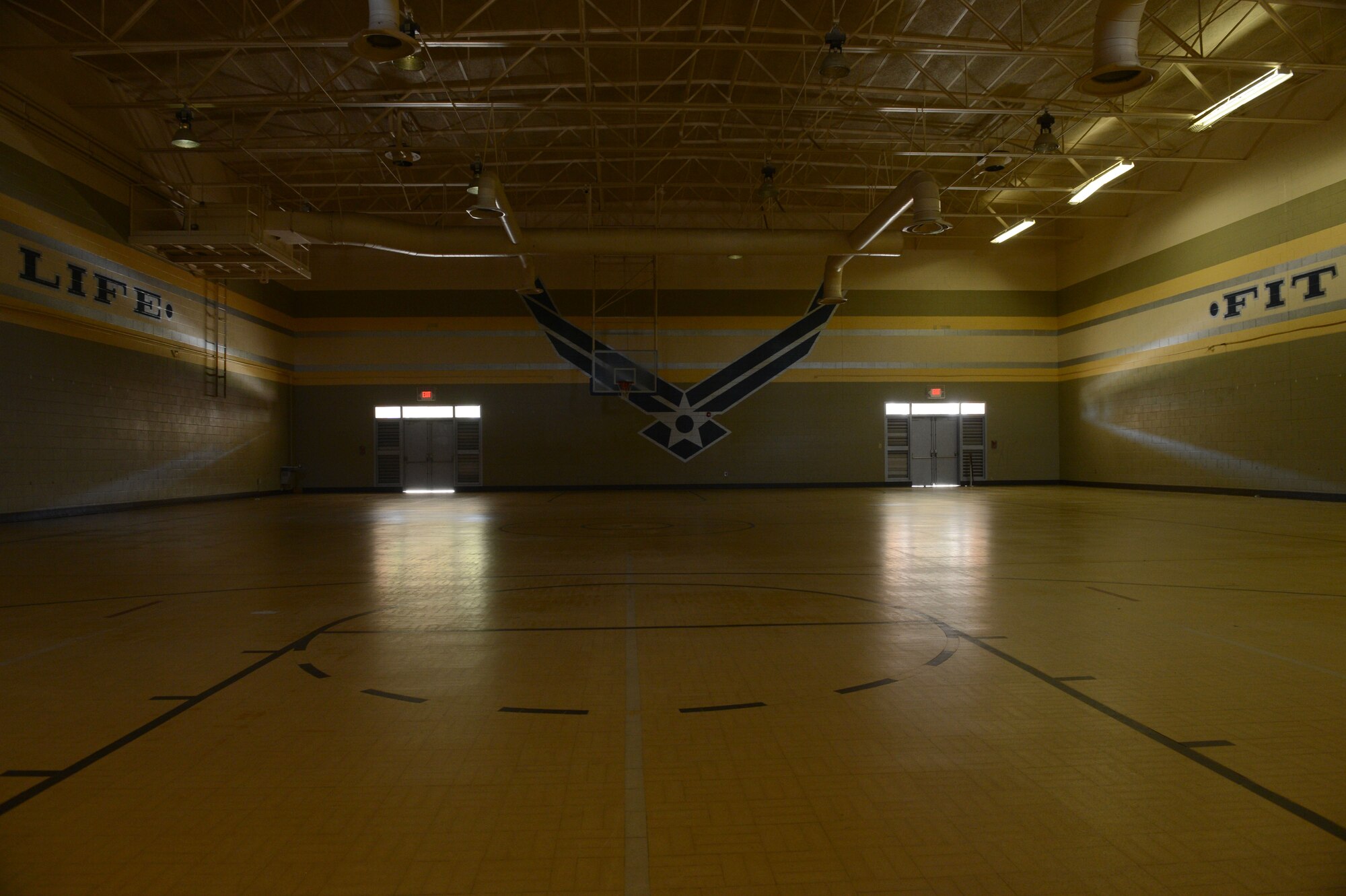 A basketball court at the Fitness and Health Center is currently vacant due to upcoming renovations at Shaw Air Force Base, S.C., Aug. 28, 2014. Due to outdated and damaged areas, the two basketball courts will receive new wood floors, sky-lights and a curtain divider added. (U.S. Air Force photo by Airman 1st Class Jensen Stidham/Released)