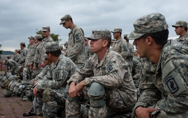 U.S. Army Staff Sgt. John Hettinger, a Legion Company paratrooper with the 1st Battalion, 503rd Infantry Regiment, 173rd Airborne Brigade, sits and waits on his rucksack at a loading zone during operations as part of Steadfast Javelin II on Rhein Ordnance Barracks, Germany, Sept. 3, 2014. The exercise sustains interoperability between NATO Allies and Partnership for Peace partner nation forces.  The interoperability has been gained during combat and multinational contingency operations over the past seven decades, while focusing on building capacity for the current and future operational environment. (U.S. Air Force photo/Airman 1st Class Jordan Castelan)