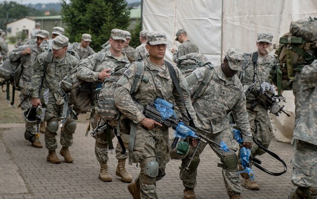 1st Battalion, 503rd Infantry Regiment, 173rd Airborne Brigade paratroopers begin their walk to a loading zone during operations as part of Steadfast Javelin II on Rhein Ordnance Barracks, Germany, Sep. 3, 2014. This NATO exercise involves over 2,000 troops from nine nations, and takes place across Estonia, Germany, Latvia, Lithuania and Poland. The exercise focuses on increasing interoperability and synchronizing complex operations between allied air and ground forces through airborne and air assault missions. (U.S. Air Force photo/Airman 1st Class Jordan Castelan)