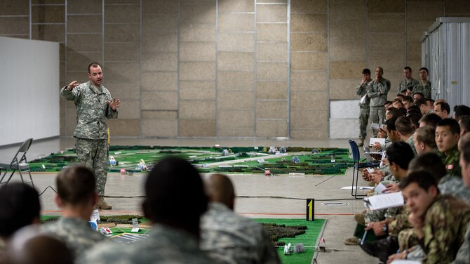 U.S. Army Command Sgt. Maj. Michael Henry, 1st Battalion, 503rd Infantry Regiment, 173rd Airborne Brigade, briefs U.S. Army, Royal Canadian Regiment and Italian Esercito soldiers on the upcoming operations as part of Steadfast Javelin II on Rhein Ordnance Barracks, Germany, Sept. 3, 2014. The exercise sustains interoperability between NATO Allies and Partnership for Peace partner nation forces.  The interoperability has been gained during combat and multinational contingency operations over the past seven decades, while focusing on building capacity for the current and future operational environment.(U.S. Air Force photo/Airman 1st Class Jordan Castelan)