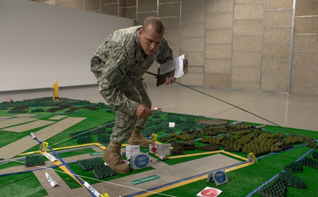 U.S. Army 1st Lt. Devin Hammilton, Legion Company platoon leader, 1st Battalion, 503rd Infantry Regiment, 173rd Airborne Brigade briefs U.S. Army, Royal Canadian Regiment and Italian Esercito soldiers on the upcoming operations as part of Steadfast Javelin II on Rhein Ordnance Barracks, Germany, Sept. 3, 2014. This NATO exercise involves over 2,000 troops from nine nations, and takes place across Estonia, Germany, Latvia, Lithuania and Poland. The exercise focuses on increasing interoperability and synchronizing complex operations between allied air and ground forces through airborne and air assault missions. (U.S. Air Force photo/Airman 1st Class Jordan Castelan)