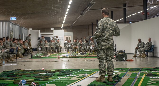 U.S. Army 2nd Lt. Andrew Gray, Legion Company platoon leader, 1st Battalion, 503rd Infantry Regiment, 173rd Airborne Brigade briefs U.S. Army, Royal Canadian Regiment and Italian Esercito soldiers on the upcoming operations as part of Steadfast Javelin II on Rhein Ordnance Barracks, Germany, Sept. 3, 2014. The exercise sustains interoperability between NATO Allies and Partnership for Peace partner nation forces.  The interoperability has been gained during combat and multinational contingency operations over the past seven decades, while focusing on building capacity for the current and future operational environment.(U.S. Air Force photo/Airman 1st Class Jordan Castelan)