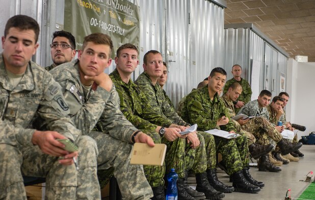 U.S. Army, Royal Canadian Regiment and Italian Esercito soldiers are briefed on the upcoming operations as part of Steadfast Javelin II on Rhein Ordnance Barracks, Germany, Sept. 3, 2014. The exercise features a number of dynamic events designed to challenge the multi-national forces in airborne operations, conventional warfare scenarios as well as stability and defensive operations, and support of civil authorities operations. (U.S. Air Force photo/Airman 1st Class Jordan Castelan)