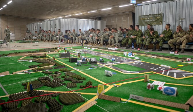 U.S. Army, Royal Canadian Regiment and Italian Esercito soldiers are briefed on the upcoming operations as part of Steadfast Javelin II on Rhein Ordnance Barracks, Germany, Sept. 3, 2014. The exercise features a number of dynamic events designed to challenge the multi-national forces in airborne operations, conventional warfare scenarios as well as stability and defensive operations, and support of civil authorities operations. (U.S. Air Force photo/Airman 1st Class Jordan Castelan)