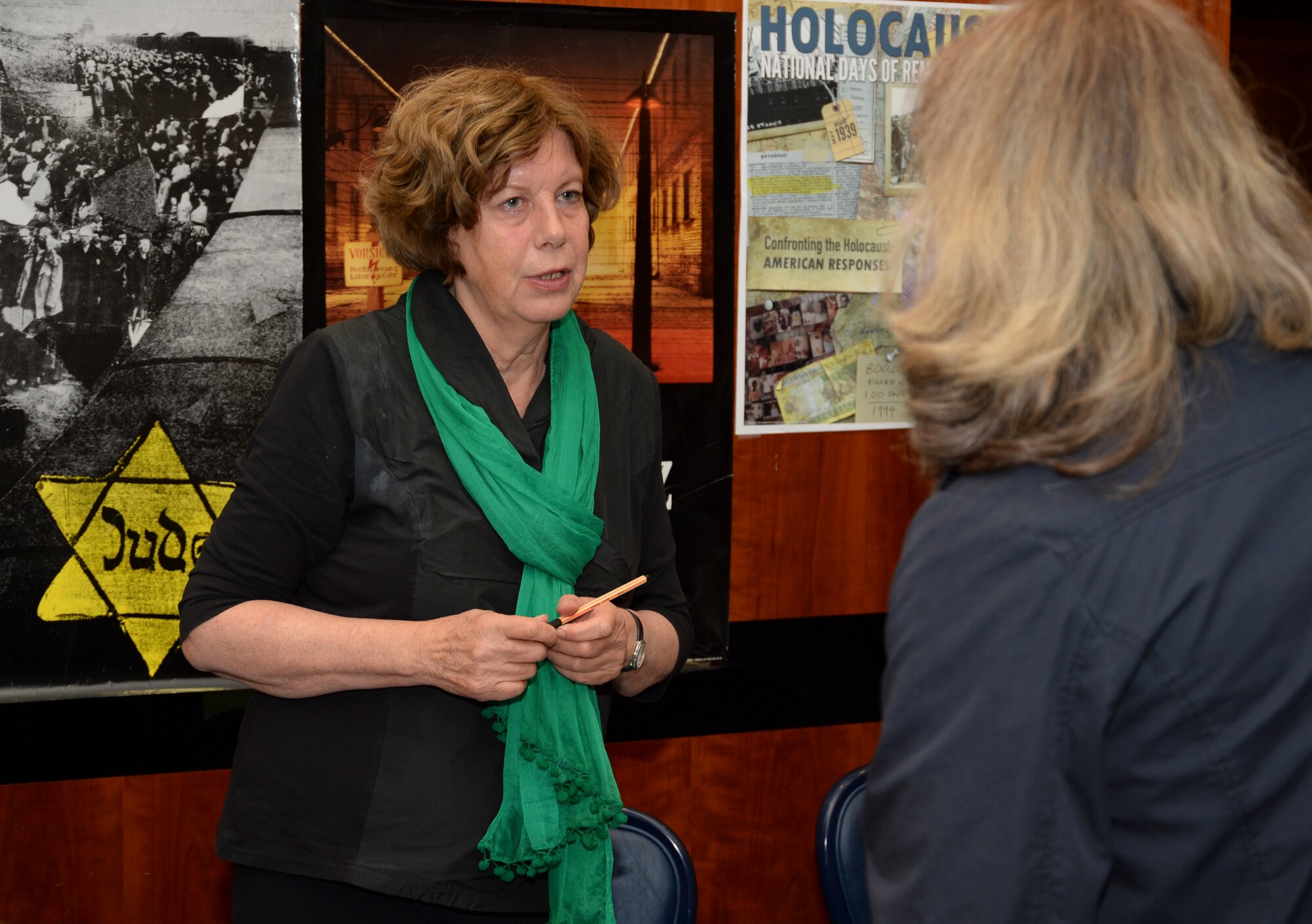 Anna Andlauer, an educator from Markt Indersdorf, Germany, speaks with a spectator as part of the Diversity Day celebration at Club Eifel at Spangdahlem Air Base, Germany, Aug. 25, 2014. The Diversity Day event included presentations like Andlauer’s on displaced child survivors of the Holocaust to demonstrate the need for respect and appreciation for all cultures. (U.S. Air Force photo by Staff Sgt. Joe W. McFadden/Released)