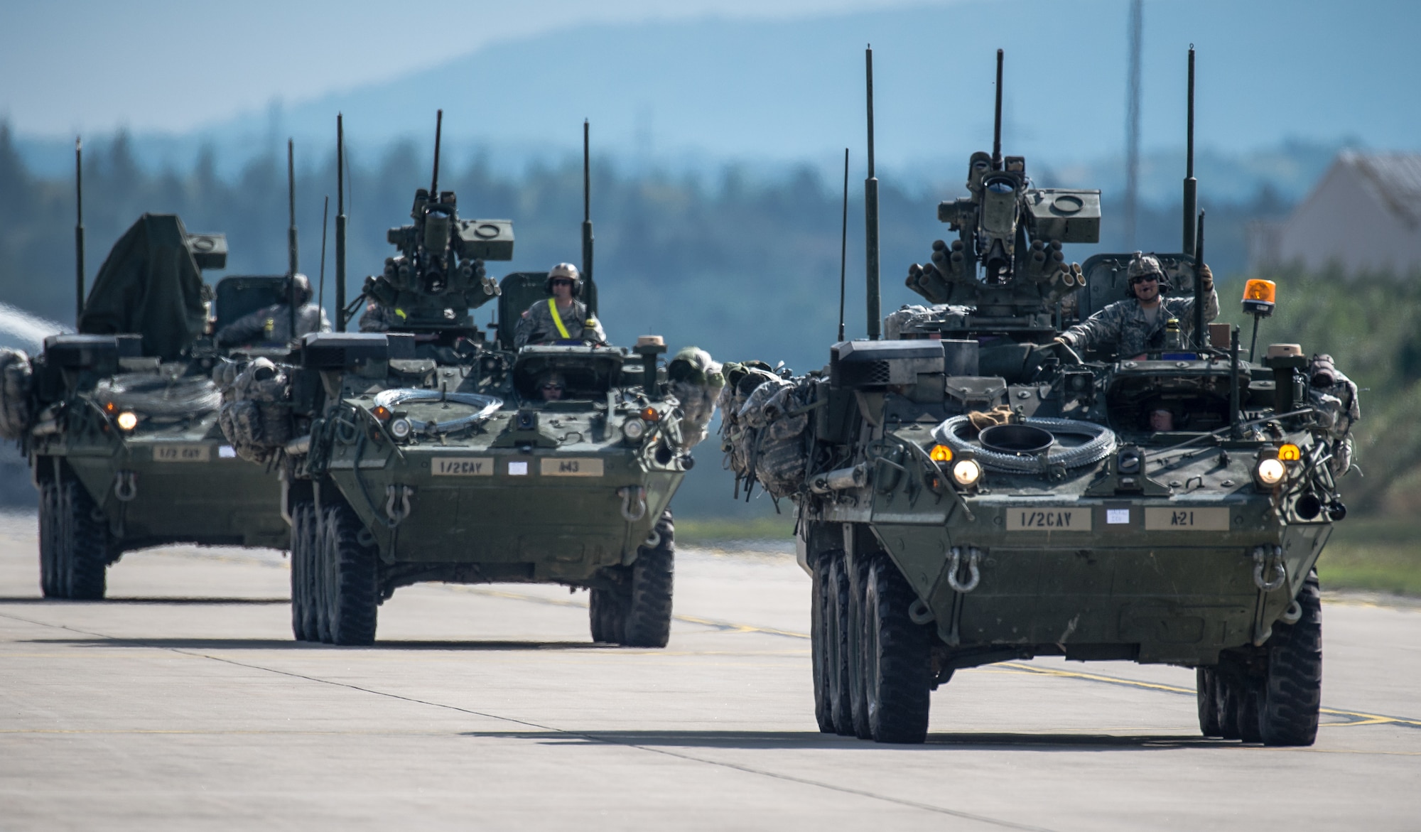 U.S. Army Stryker infantry carrier vehicles convoy across the flightline during operations in support of Steadfast Javelin II on Ramstein Air Base, Germany, Sept. 3, 2014. The exercise features a number of dynamic events designed to challenge the multi-national forces in airborne operations, conventional warfare scenarios as well as stability and defensive operations, and support of civil authorities operations. (U.S. Air Force photo/Airman 1st Class Jordan Castelan)