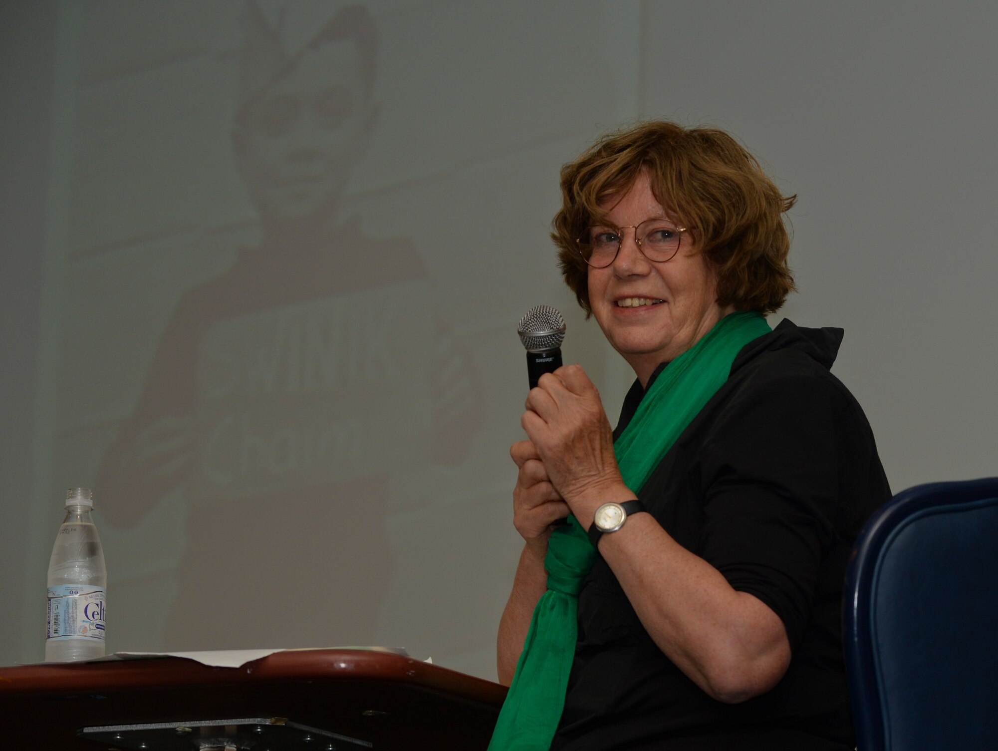 Anna Andlauer, an educator from Markt Indersdorf, Germany, speaks about child survivors of the Holocaust during her presentation as a part of the Diversity Day celebration at Club Eifel at Spangdahlem Air Base, Germany, Aug. 25, 2014. Andlauer commented on how child survivors, such as the one pictured, would wear Allied military flight caps to dress like their liberators.  (U.S. Air Force photo by Staff Sgt. Joe W. McFadden/Released)