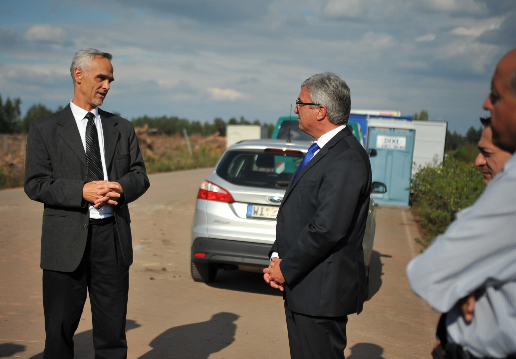 Roger Lewentz, Rheinland Pfalz Minister of the Interior, visits the Rhine Ordnance Barracks Medical Center construction site, adjacent to Ramstein Air Base, Germany, with Lt. Gen. Tom Jones, U.S. Air Forces in Europe-Air Forces Africa vice commander, and Brig. Gen. Patrick X. Mordente, 86th Airlift Wing commander,Sep. 2, 2014. Jones hosted Lewentz on his official visit to meet with senior U.S. Air Force leaders and learn about the strategic importance of the Air Force’s mission in Europe.  The State of Rheinland-Pfalz is home to Ramstein and Spangdahlem Air Bases, and once completed, the ROBMC will serve as the region’s premier U.S. military medical center.  (U.S. Air Force photo/Senior Airman Hailey Haux)