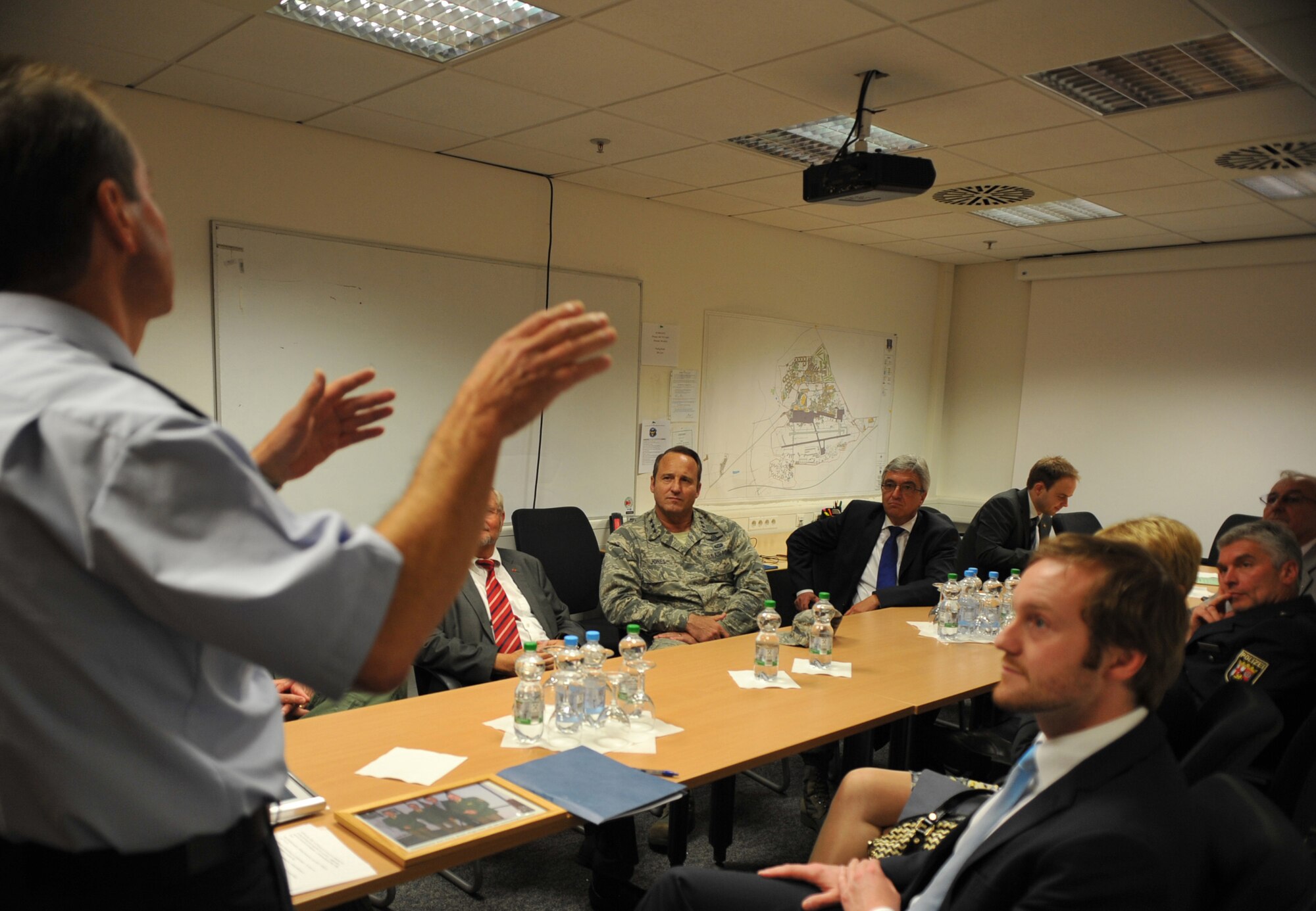 German Police lieutenants brief Roger Lewentz, Rheinland Pfalz Minister of the Interior, and Lt. Gen. Tom Jones, U.S. Air Forces in Europe-Air Forces Africa vice commander, about their roles in the German Police Liaison Office during a visit to Ramstein Air Base, Germany, Sep. 2, 2014. Jones hosted Lewentz on his official visit to meet with senior U.S. Air Force leaders and learn about the strategic importance of the Air Force’s mission in Europe.  The State of Rheinland-Pfalz is home to Ramstein and Spangdahlem Air Bases.  (U.S. Air Force photo/Senior Airman Hailey Haux)