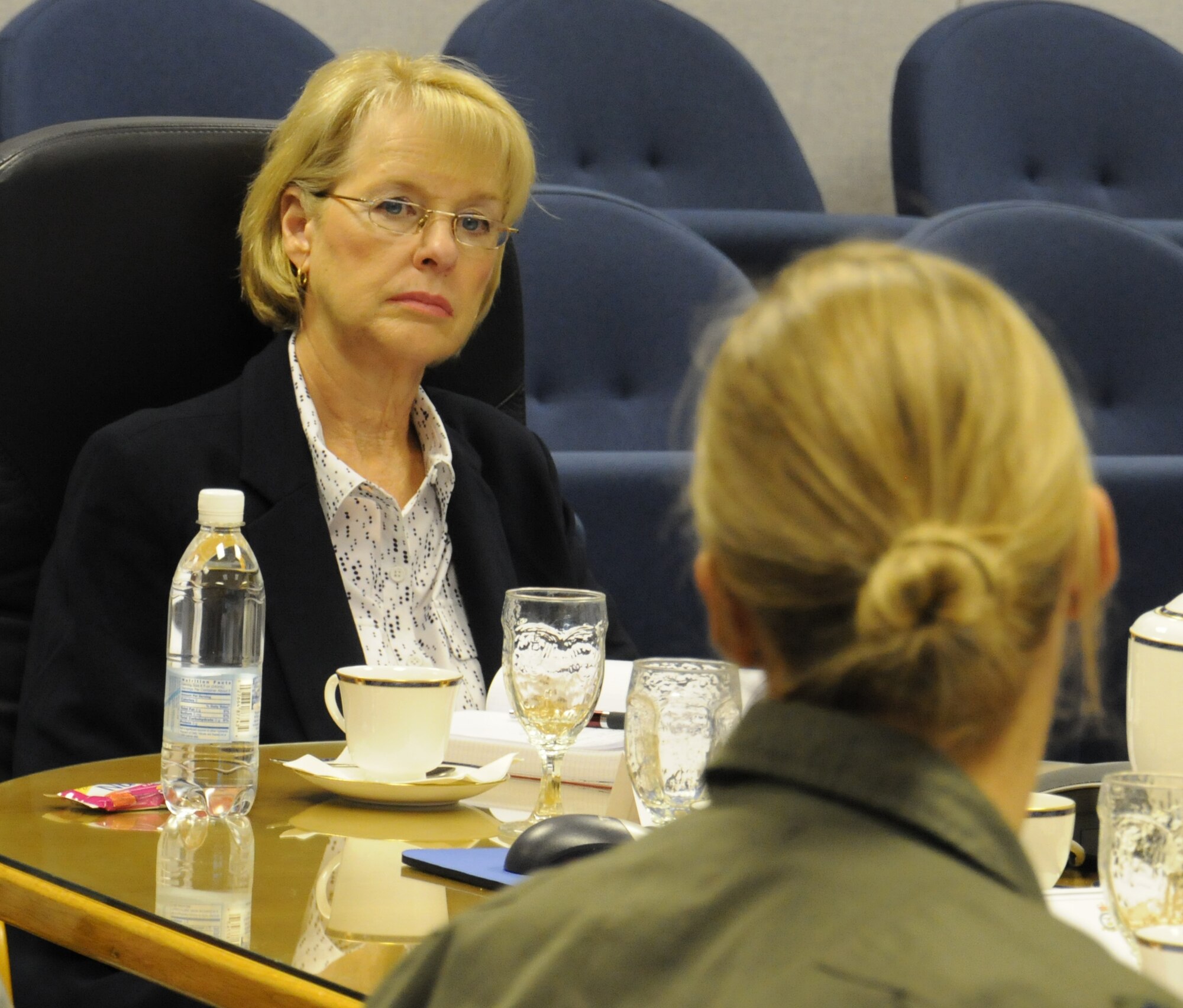 U.S. Air Force Lt. Col. Christina Clausnitzer, right, 100th Operations Group deputy commander, gives a mission brief of the group she leads to Jeanette James, subcommittee on military personnel majority lead, Aug. 19, 2014, on RAF Mildenhall, England. James met with group commanders during a mission brief led by U.S. Air Force Brig. Gen. Douglas A. Cox, U.S. Air Forces in Europe-United Kingdom director, and U.S. Air Force Col. Kenneth T. Bibb Jr., 100th Air Refueling Wing commander. (U.S. Air Force photo/Gina Randall/Released)