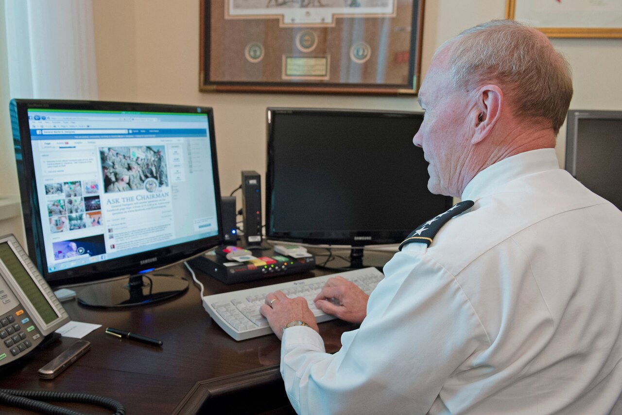 Army Gen. Martin E. Dempsey, chairman of the Joint Chiefs of Staff, communicates with service members as he hosts a Facebook town hall meeting from his office at the Pentagon, Sept. 4, 2014. DoD photo by Navy Petty Officer 1st Class Daniel Hinton
