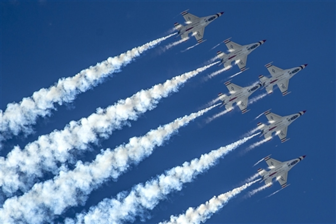 The Air Force Thunderbirds, the service's air demonstration team, perform the delta loop maneuver during a practice show in Kalispell, Mont., Aug. 29, 2014.