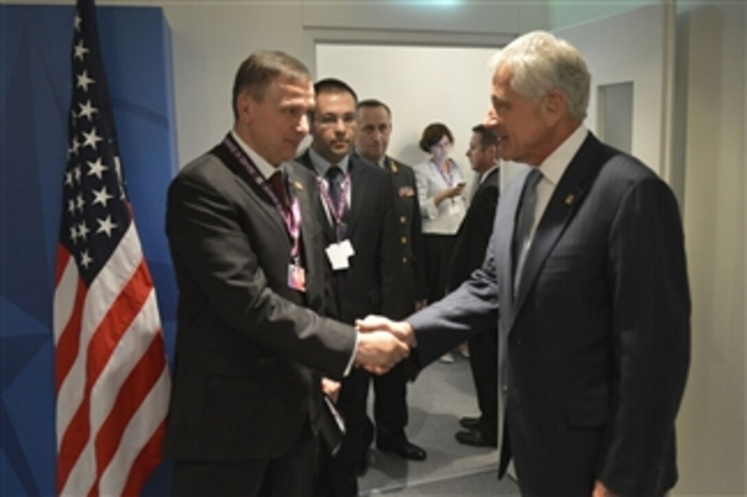 U.S. Defense Secretary Chuck Hagel meets with Ukrainian Defense Minister Col. Gen. Valeriy Heletey during the NATO summit in Wales, Sept. 4, 2014.