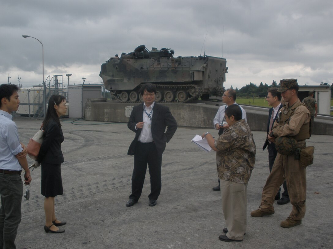 ESC (GOJ and USFJ) conducts a site tour of CATC Camp Fuji and receives a brief regarding the design and use of wash racks for Combat Assault Battalion's (3d Marine Division) Amphibious Assault Vehicle.