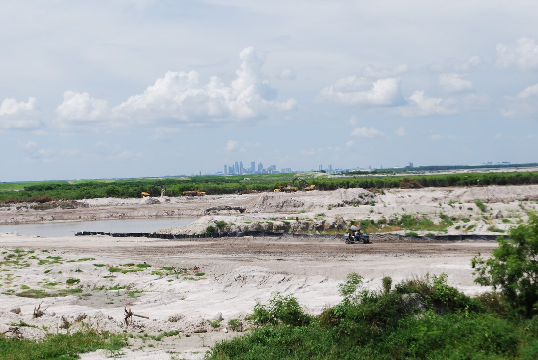 With Tampa in the distance, dike construction continues at 3-D to increase its capacity to 15-million cubic yards for use in disposing Tampa Harbor Project dredged materials.