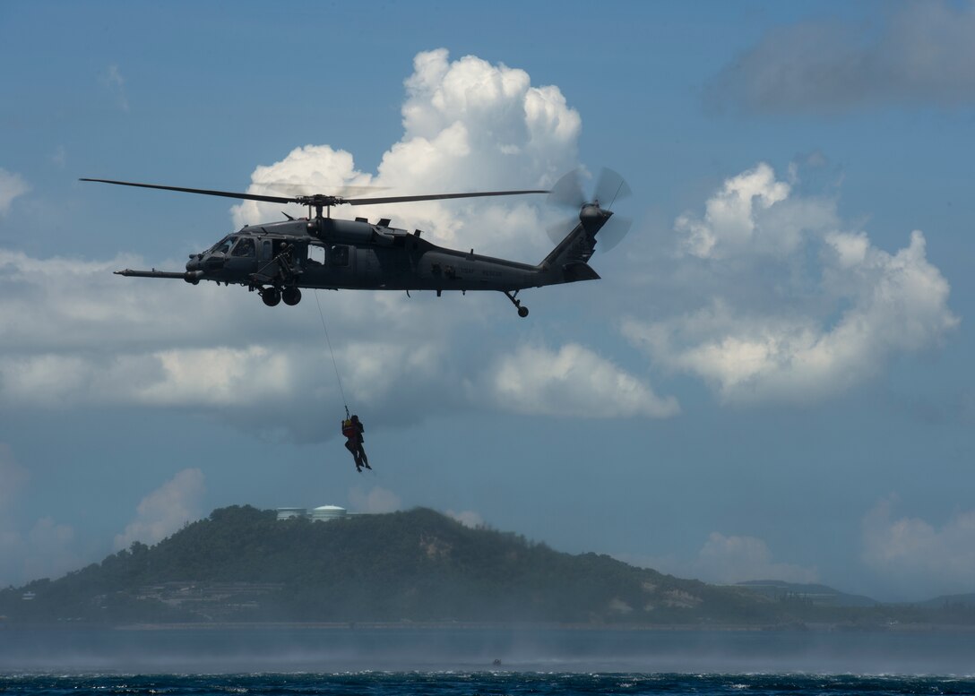 HH-60 Pave Hawk crew members participate in a downed pilot exercise Aug 26, 2014, at Kadena Air Base, Japan. The 31st Rescue Squadron uses various fixed- and rotary-wing insertion and extraction assets providing combat and humanitarian search, rescue and medical assistance in all environments. (U.S. Air Force photo/Senior Airman Justyn M. Freeman)