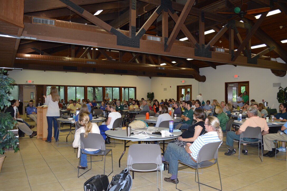 During small group breakout sessions on the second day of the Everglades Cooperative Invasive Species Management Area Summit, members discuss and plan action items and strategies for the management of invasive plants and animals in 2015.