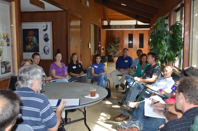 During small group breakout sessions on the second day of the Everglades Cooperative Invasive Species Management Area Summit, members discuss and plan action items and strategies for the management of invasive plants and animals in the coming year.