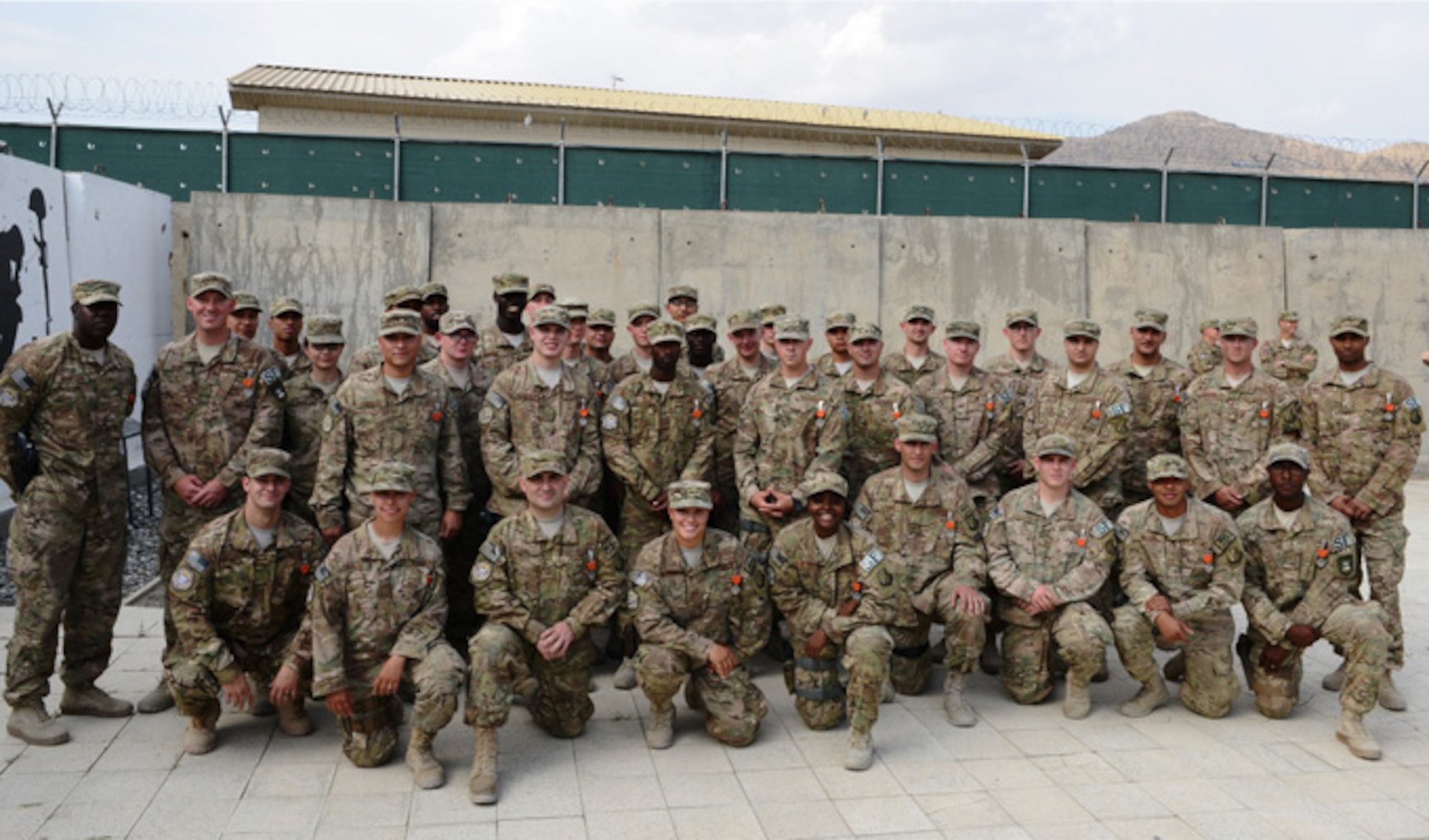Members of the 439th Air Expeditionary Advisory Squadron security forces pose for a photo just after receiving Air Force Combat Action Medals during a ceremony  Sept. 2, 2014, at Forward Operating Base Oqab, Kabul, Afghanistan. The Airmen were recognized for actions defending FOB Oqab,  Afghan air force’s Kabul Air Wing and a NATO base, all located on Kabul International Airport, from a complex attack July 17, 2014. (U.S. Air Force photo/Senior Master Sgt. Mike Hammond)