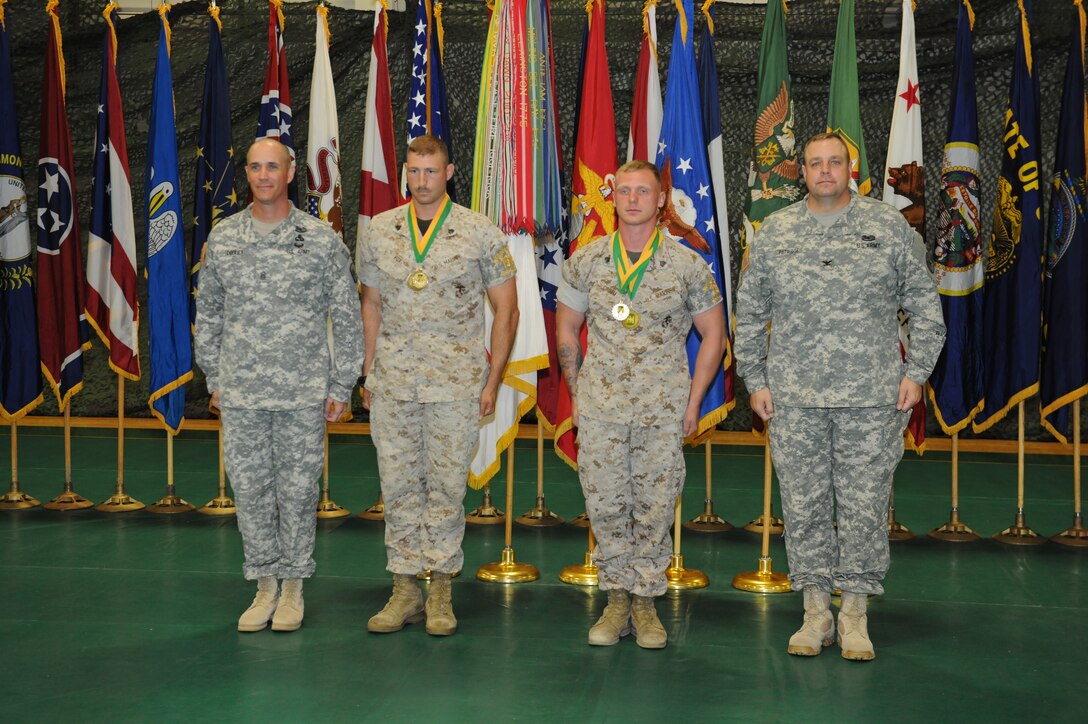 Sergeant Shane Fox and Sergeant George Grimm Jr. proved that Marines really are amphibious and won the basic water survival event on day one. From left to right: Command Sergeant Major Scott Dooley, 14th Military Police Brigade command Sergeant Major / Sergeant Fox / Sergeant Grimm / Col. Bryan Patridge, 14th Military Police Brigade commander.