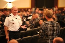 Chairman of the Joint Chiefs of Staff Gen. Martin Dempsey answers a question during a town hall meeting with Marines, sailors and former service members aboard Naval Station Great Lakes, Ill., Sept. 5. Dempsey discussed a wide range of topics including involvement in the Middle East, and how budget cuts affect service members worldwide. 