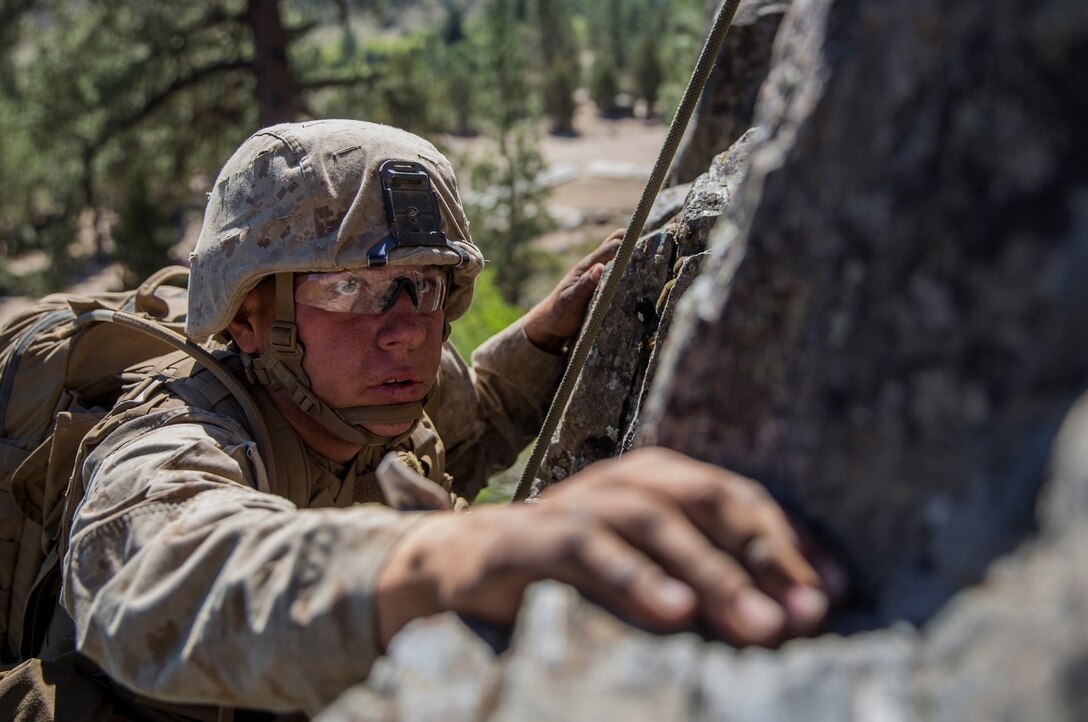 U.S. Marine Pfc. Brandon Daniels, 18, from Dayton, Texas, navigates his way up a cliff during Mountain Exercise 2014 aboard Marine Corps Mountain Warfare Training Center in Bridgeport, Calif., Sept. 1, 2014. Daniels is an infantry rifleman with 2nd Platoon, Lima Company, 3rd Battalion, 1st Marine Regiment. Marines with 3rd Battalion, 1st Marine Regiment will become the 15th Marine Expeditionary Unit’s ground combat element in October. Mountain Exercise 2014 develops critical skills the battalion will need during deployment. 