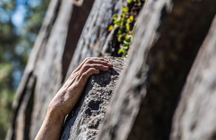 U.S. Marine Pvt. Tyler Knotts, 19, from Kingwood, W.V., grips a ledge as he navigates his way up a cliff during Mountain Exercise 2014 aboard Marine Corps Mountain Warfare Training Center in Bridgeport, Calif., Sept. 1, 2014. Rice is an infantry rifleman with 1st Platoon, Lima Company, 3rd Battalion, 1st Marine Regiment. Marines with 3rd Battalion, 1st Marine Regiment will become the 15th Marine Expeditionary Unit’s ground combat element in October. Mountain Exercise 2014 develops critical skills the battalion will need during deployment. (U.S. Marine Corps photo by Sgt. Emmanuel Ramos/Released)
