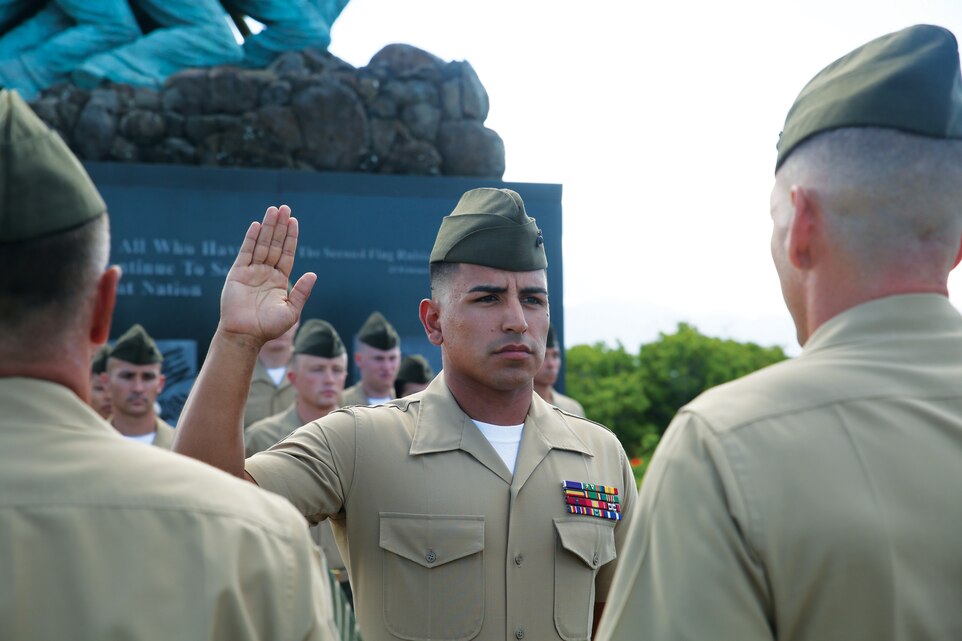 MARINE CORPS BASE HAWAII - Sgt. Rafael Cervantes Jr., a combat-injured Marine with Wounded Warrior Battalion West-Detachment Hawaii, raises his hand during his re-enlistment ceremony at the Pacific War Memorial aboard Marine Corps Base Hawaii, Aug. 25, 2014. (U.S. Marine Corps photo by Cpl. Suzanna Knotts)