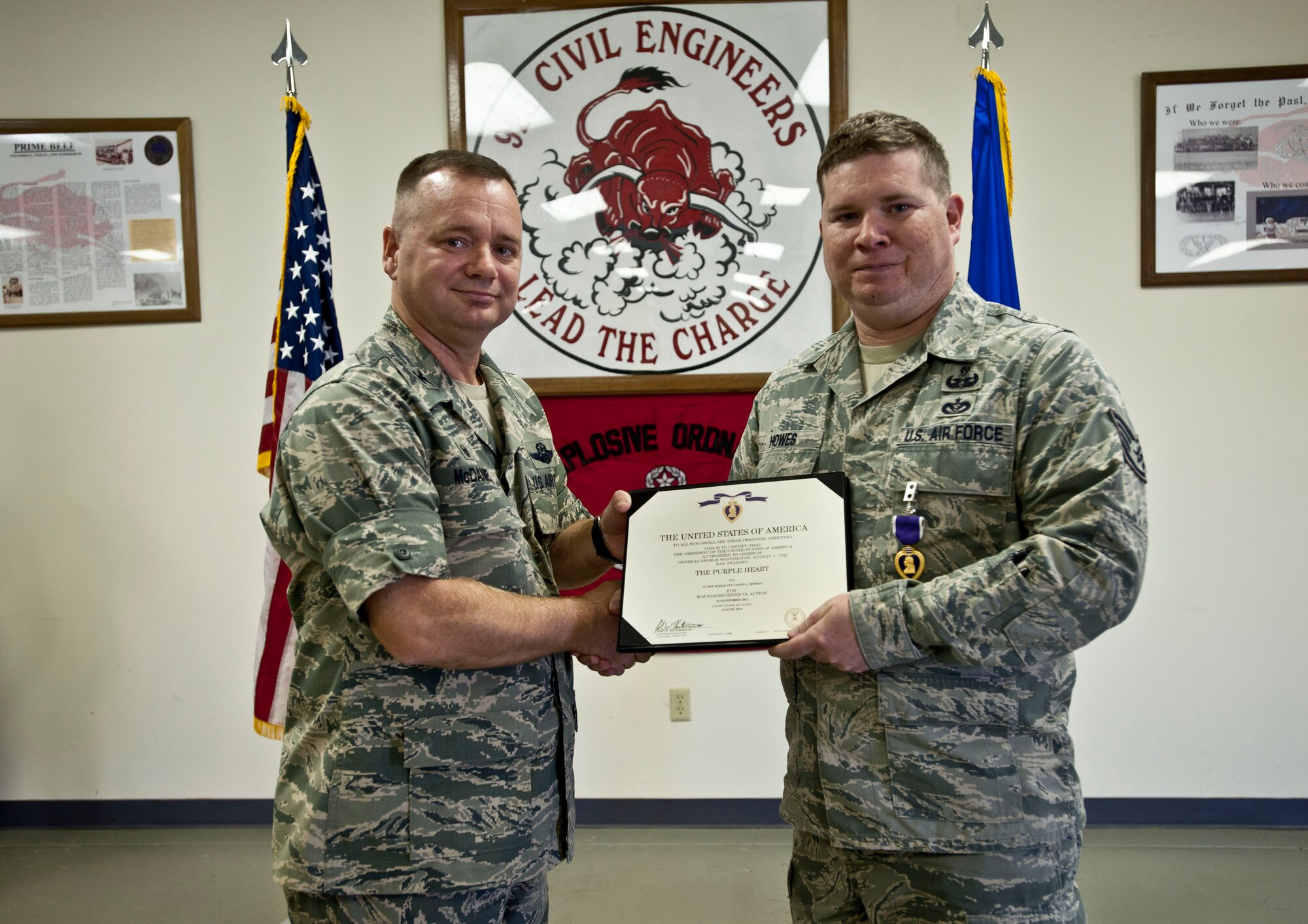 Staff Sgt. Jason Howes, 92nd Civil Engineer Squadron Explosive Ordnance Disposal craftsman, receives the Purple Heart medal by Col. Brian McDaniel, 92nd Air Refueling Wing commander, Sept. 5, 2014, at Fairchild Air Force Base, Washington. The Purple Heart is a United States military decoration awarded in the name of the President to those wounded or killed, while serving, on or after April 5, 1917, with the U.S. military.  (U.S. Air Force photo by Staff Sgt. Veronica Montes/Released)