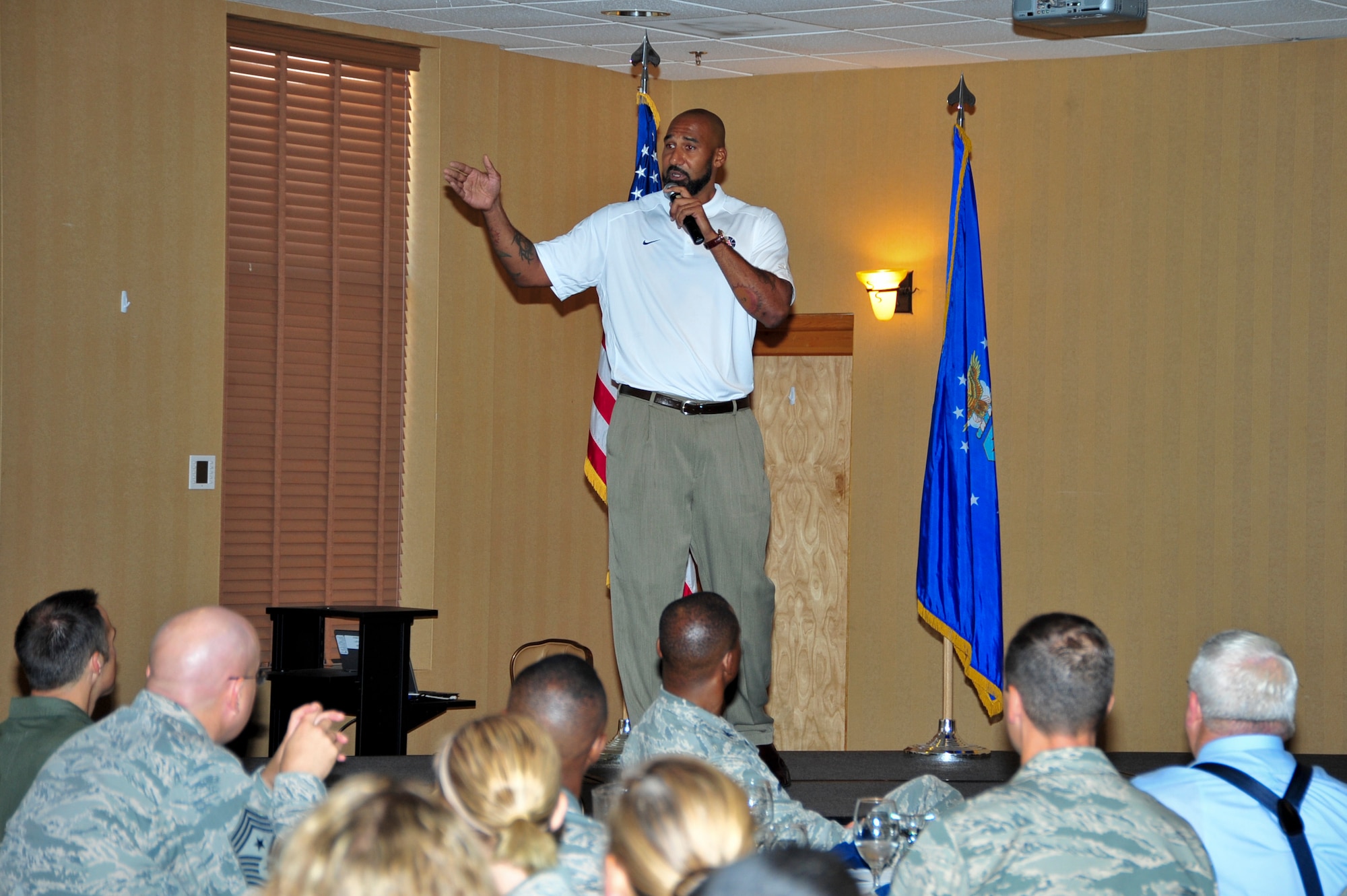 Joseph Blair, University of Arizona undergraduate assistant basketball coach, speaks at the 2014 Arizona Combined Federal Campaign breakfast at Davis-Monthan Air Force Base, Ariz., Sept. 4, 2014.  The event informed the attendees of the fundraiser and provided motivation to give and encourage others to do the same. (U.S. Air Force Photo by Airman 1st Class Chris Massey)