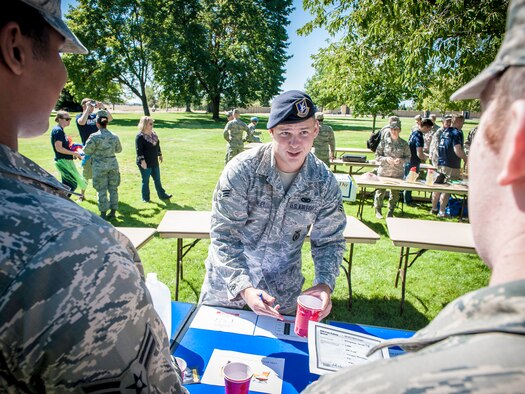 Senior Airman Tim Riley, 92nd Security Forces Squadron police services program manager, explains the importance of understanding what’s considered an average shot and what one of these drinks actually looks like during the DUI Fair at Fairchild Air Force Base, Washington, Sept. 5, 2014. DUIs are a concern across the Air Force and the statistics show it doesn’t seem to be getting better. Events like these allowed the nearly 100 Airmen an opportunity to experience a simulated drunken state safely and under the guidance of security forces and Team Fairchild’s locally run Air Force Drug and Alcohol Abuse Program. (U.S. Air Force photo by Staff Sgt. Benjamin W. Stratton/Released)
