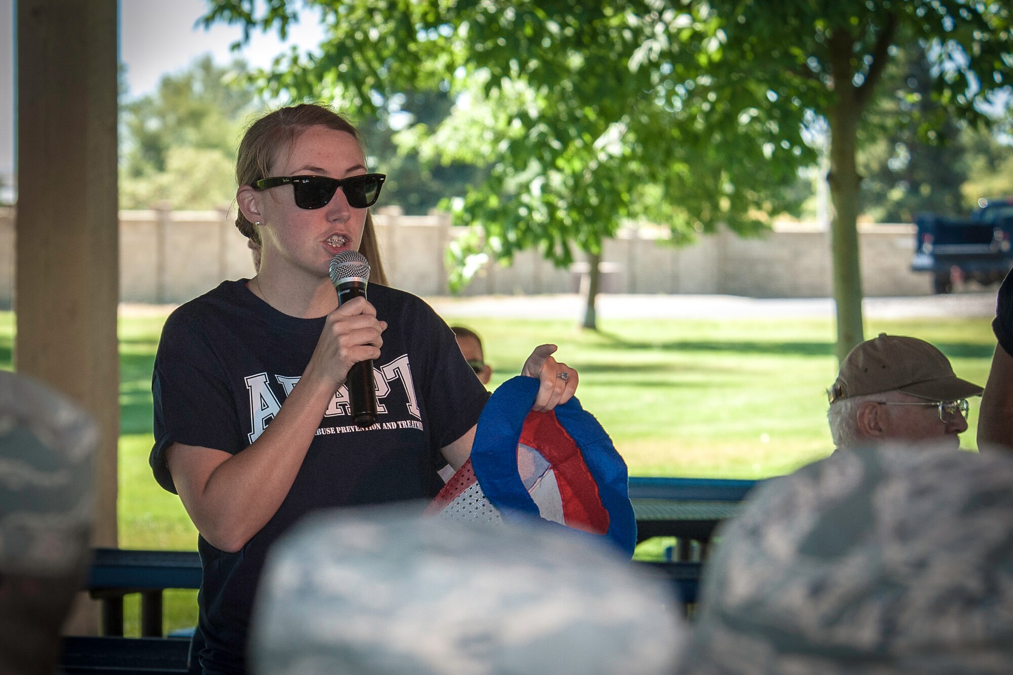 Staff Sgt. Tanya Nicolay, 92nd Aerospace Medicine Squadron force health management NCO in charge, addresses attendees during the DUI Fair at Fairchild Air Force Base, Washington, Sept. 5, 2014. Participants were able to experience beer goggles during a field sobriety test, speak with legal and security forces representatives and take control of the impaired and distracted driving simulator. (U.S. Air Force photo by Staff Sgt. Benjamin W. Stratton/Released)