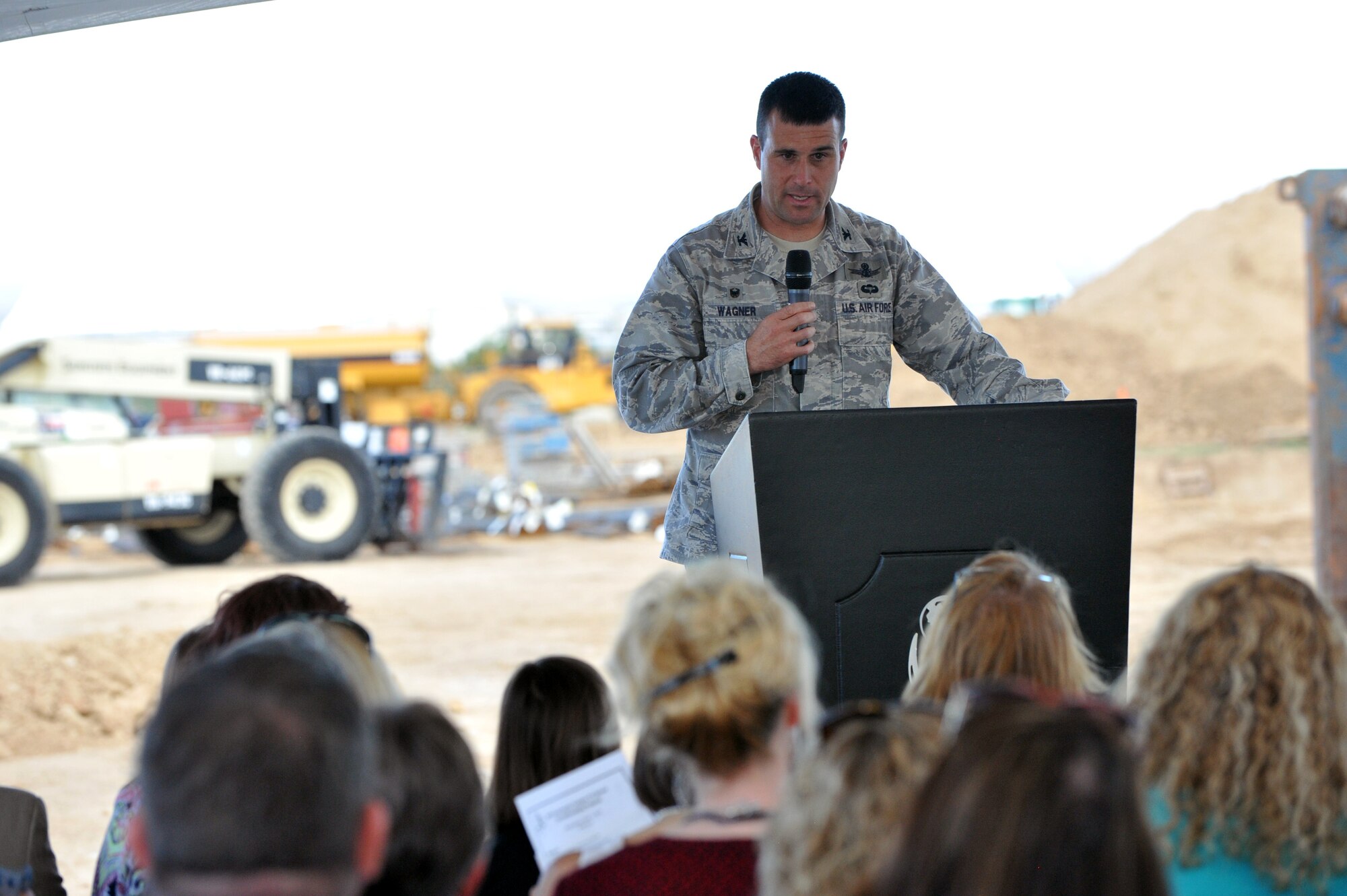 Col. John Wagner, 460th Space Wing commander speaks during the Aurora Public Schools Community Campus P-8 groundbreaking ceremony Sept. 3, 2014, in Aurora, Colorado. The new school will be just outside of Buckley’s fence, benefitting the families and students of Team Buckley. (U.S. Air Force photo by Airman Emily E. Amyotte/Released)