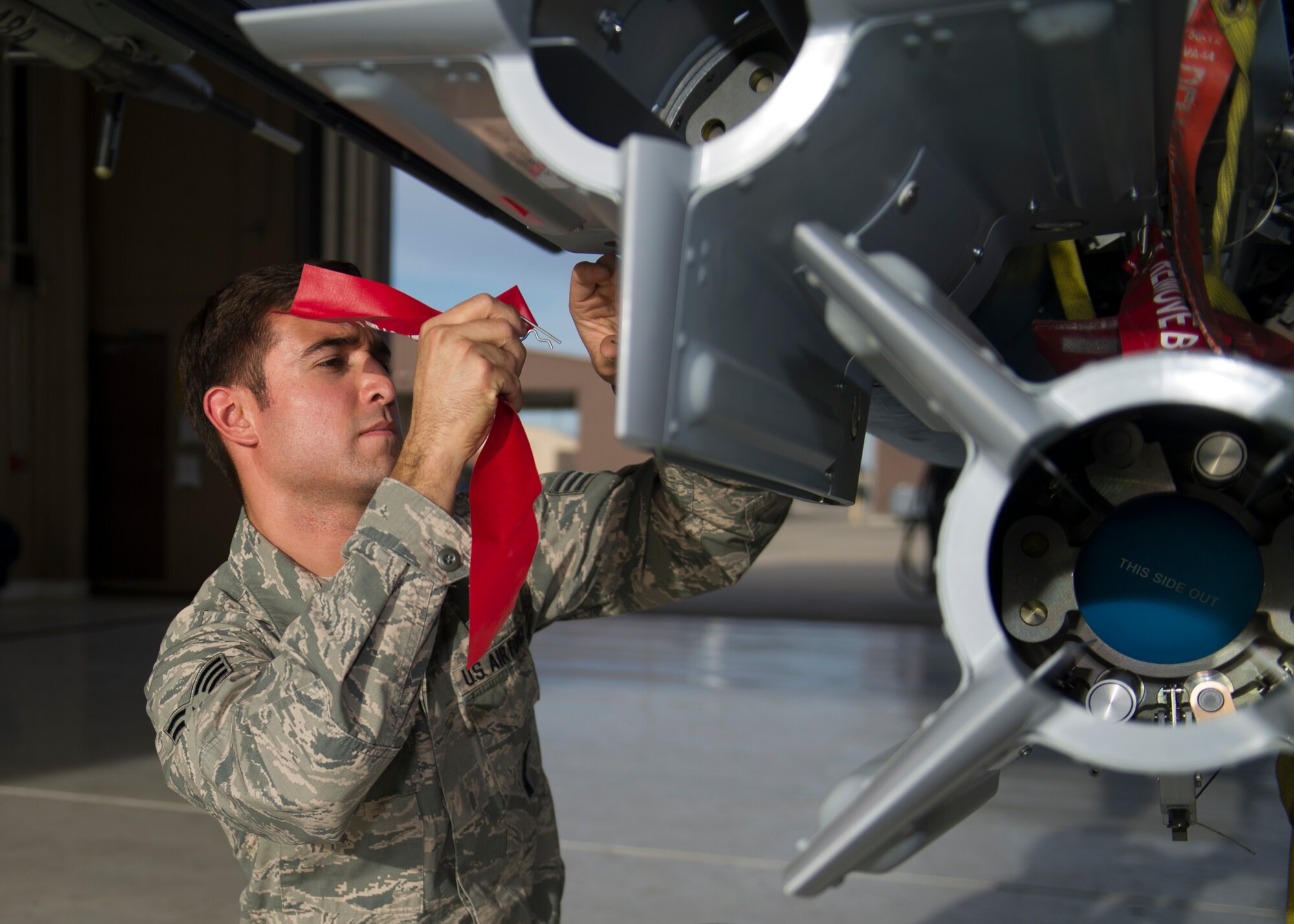 Chief’s Choice award recipient, Seinor Airman Nicholes Inloes-Munoz, 311th Aircraft Maintenance Unit Weapons Load crew member