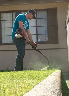 Airman 1st Class Tyler Boyd, 49th Materiel Maintenance Group structural journeyman, trims the edges of a lawn during The Otero County Day of Caring in Alamogordo, N.M., Sept. 5. The Day of Caring is an event sponsored by the United Way of Otero County. Volunteers from Holloman and the local community perform various tasks for individuals who are unable to accomplish the tasks themselves or cannot afford to have the work done. Such tasks include fixing their homes, yards or other facilities, while also creating a strong relationship between Team Holloman and the surrounding communities. (U.S. Air Force photo by Staff Sgt. E’Lysia Wray/Released)