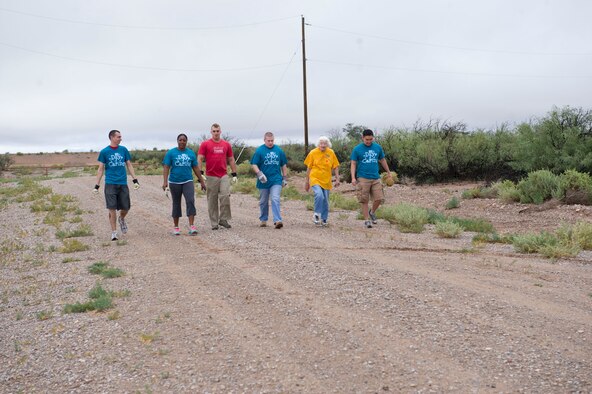 Members from Team Holloman head out to remove weeds at a local animal shelter in Alamogordo, N.M., Sept. 5. The Day of Caring is an event sponsored by the United Way of Otero County. Volunteers from Holloman and the local community perform various tasks for individuals who are unable to accomplish the tasks themselves or cannot afford to have the work done. Such tasks include fixing their homes, yards or other facilities, while also creating a strong relationship between Team Holloman and the surrounding communities. (U.S. Air Force photo by Staff Sgt. E’Lysia Wray/Released)