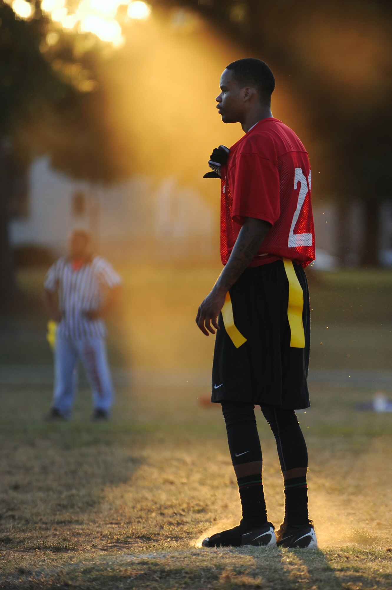 U.S. Air Force Senior Airman Nigel Scott, 20th Logistics Readiness Squadron equipment journeyman, prepares for a play during an intramural flag football game at Shaw Air Force Base, S.C., Sept. 4, 2014. The flag football season began Sept. 3, and is scheduled to go until the middle of October. (U.S. Air Force photo by Airman 1st Class Michael Cossaboom/Released)