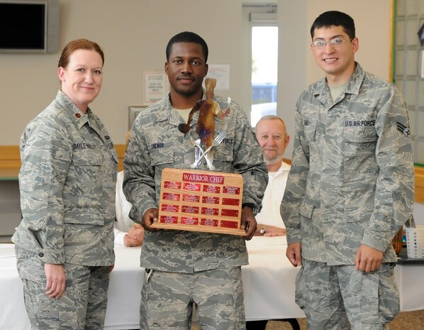 Maj. Karen Dayle-Horsley, 341st Force Support Squadron commander, poses with Staff Sgt. Ricardo Thenor and Senior Airman Justin Ruiz, representing the 341st FSS fitness center, following the team’s win at the Warrior Chef Sept. 4. Thenor and Ruiz’s main entrée was a raspberry salad, raspberry wild wings, and a raspberry lime smoothie. (U.S. Air Force photo/Airman 1st Class Joshua Smoot)