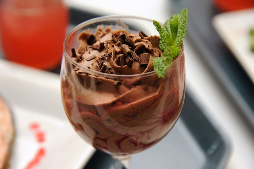 Senior Airman Juan Cimental and Staff Sgt. Sara Hardy, 341st Force Support Squadron chefs, created this raspberry chocolate mousse for the Warrior Chef competition Sept. 4 at the Elkhorn Dining Facility. Some of the dishes that were prepared included raspberry glazed salmon, raspberry wild wings, raspberry cobbler, bacon raspberry parfait, chocolate raspberry cupcakes and raspberry chicken tacos. (U.S. Air Force photo/Airman 1st Class Joshua Smoot)