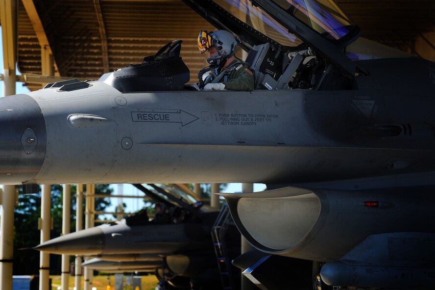 Royal Air Force Flight Lieutenant Benjamin Cable, 79th Fighter Squadron assistant director of operations, gets settled in the cockpit of his F-16CM Fighting Falcon before taking off, Aug. 27, 2014 at Shaw Air Force Base, S.C. Prior to flying the F-16, Cable flew the Tornado GR4, a low-level, high-speed aircraft. Cable is part of the Royal Air Force Exchange Officer program which has given him the opportunity to train and fly with the men and women of the 79th FS. (U.S. Air Force photo by Staff Sgt. Kenny Holston/Released)