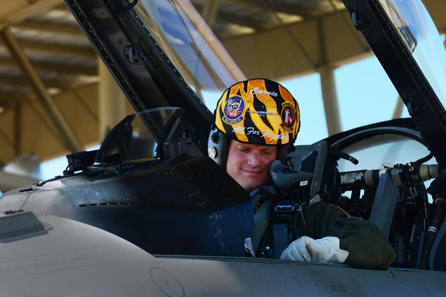 Royal Air Force Flight Lieutenant Benjamin Cable, 79th Fighter Squadron assistant director of operations, sits in the cockpit of an F-16CM Fighting Falcon at Shaw Air Force Base, S.C., Aug. 27, 2014. Cable will be stationed at Shaw for three years, where he will learn from and teach members of the 79th FS. (U.S. Air Force photo by Airman 1st Class Michael Cossaboom/Released)