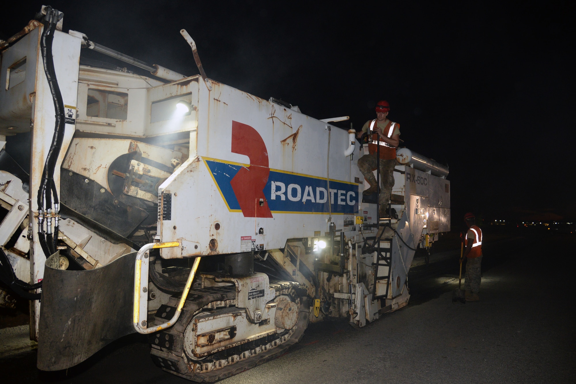 U.S. Air Force Airman 1st Class Casey Kutlik, 823rd Rapid Engineer Deployable Heavy Operational Repair Squadron Engineers pavement and construction apprentice, assigned to Hurlburt Field, Fla., drives a Roadtec RX-60C milling machine at Shaw Air Force Base, S.C., Sept. 2, 2014. The 823rd RED HORSE has been repaving sections of Shaw roads since March. (U.S. Air Force photo by Airman 1st Class Jonathan Bass/Released)