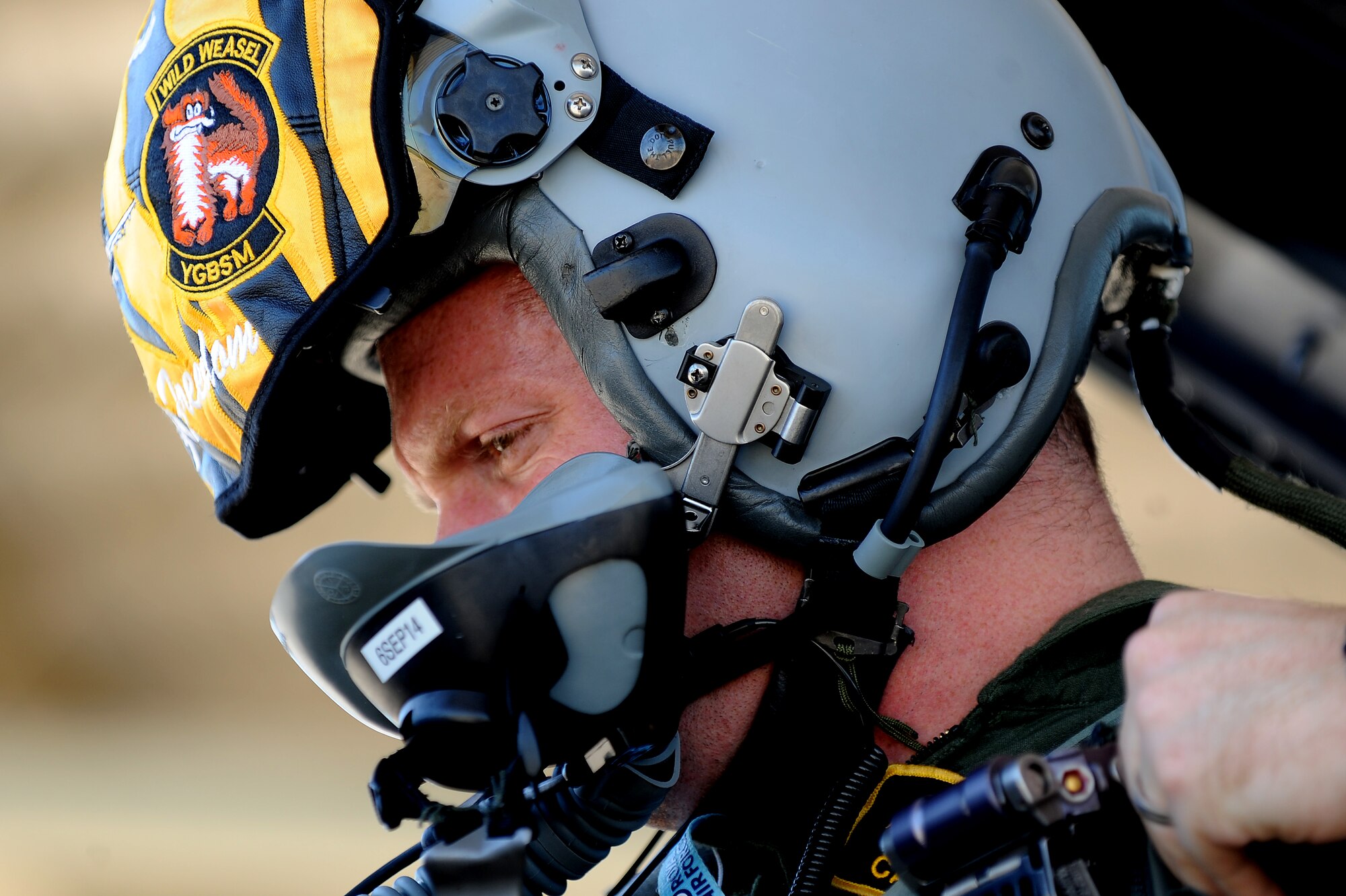 Royal Air Force Flight Lieutenant (Capt.) Benjamin Cable, 79th Fighter Squadron assistant director of operations, inspects his gear in the cockpit of an F-16CM Fighting Falcon at Shaw Air Force Base, S.C., Aug. 27, 2014. Cable is part of an exchange program that allows RAF members to be a part of a U.S. squadron. (U.S. Air Force photo by Airman 1st Class Michael Cossaboom/Released)