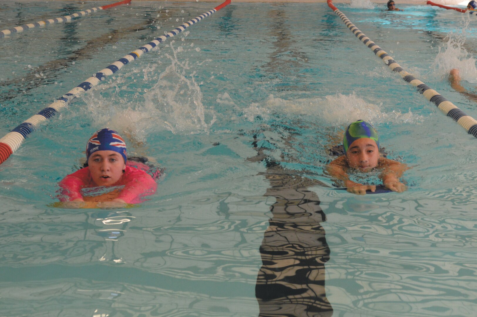 Sinead Bolton, 17, left, and Cassie Resler, 12, right, perform 25-meter flutter kicks Aug. 12 at the Skylark Aquatic Center, Joint Base San Antonio-Lackland. (Photos by Jose T. Garza III).