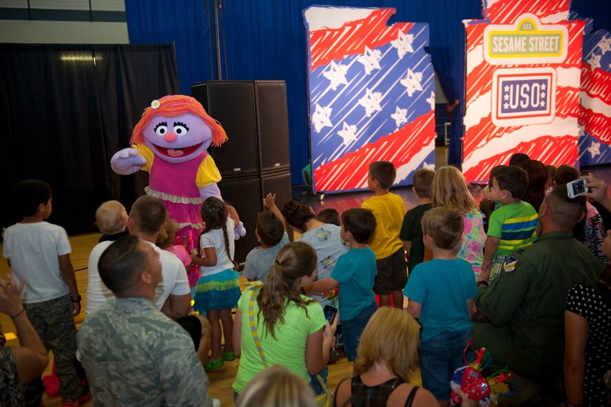 A character from the popular children’s show, Sesame Street, interacts with families from Team Holloman Sept. 3, at Holloman Air Force Base, N.M. The United Service Organizations presented the Sesame Street/USO Experience for Military Families to help create lasting memories for service members and their families, while dealing with challenges of military life. The 30-minute show consisted of three songs where Sesame Street characters sang, danced and interacted with families in the audience. (U.S. Air Force photo by Airman 1st Class Emily A. Kenney/ Released)