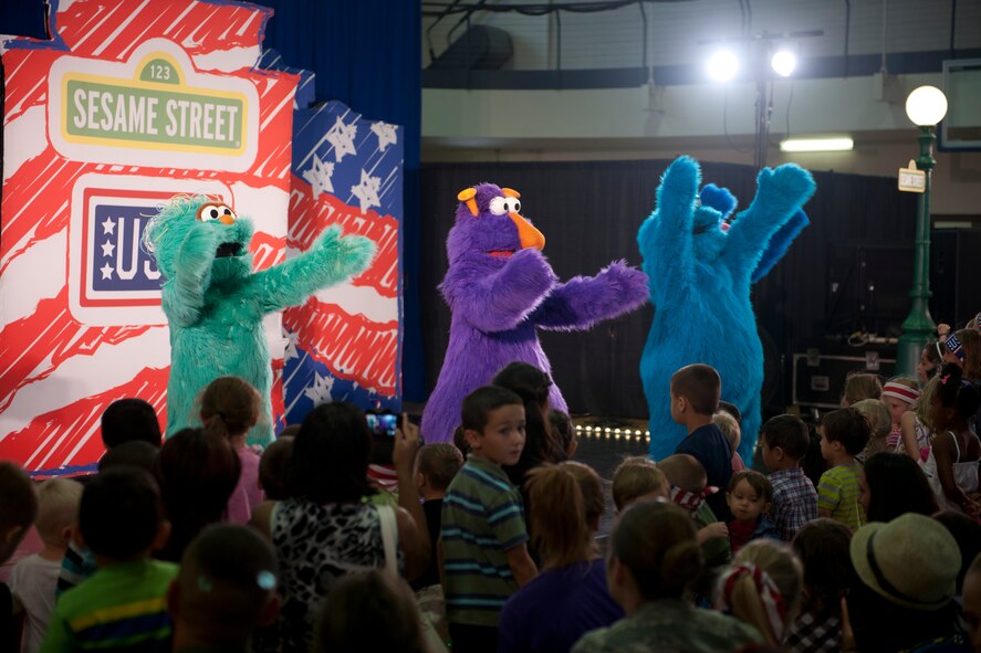 Characters from the popular children’s show, Sesame Street, perform for Team Holloman families Sept. 3, at Holloman Air Force Base, N.M.  The United Service Organizations presented the Sesame Street/USO Experience for Military Families to help create lasting memories for service members and their families, while dealing with challenges of military life. The 30-minute show consisted of three songs where Sesame Street characters sang, danced and interacted with families in the audience. (U.S. Air Force photo by Airman 1st Class Emily A. Kenney/ Released)