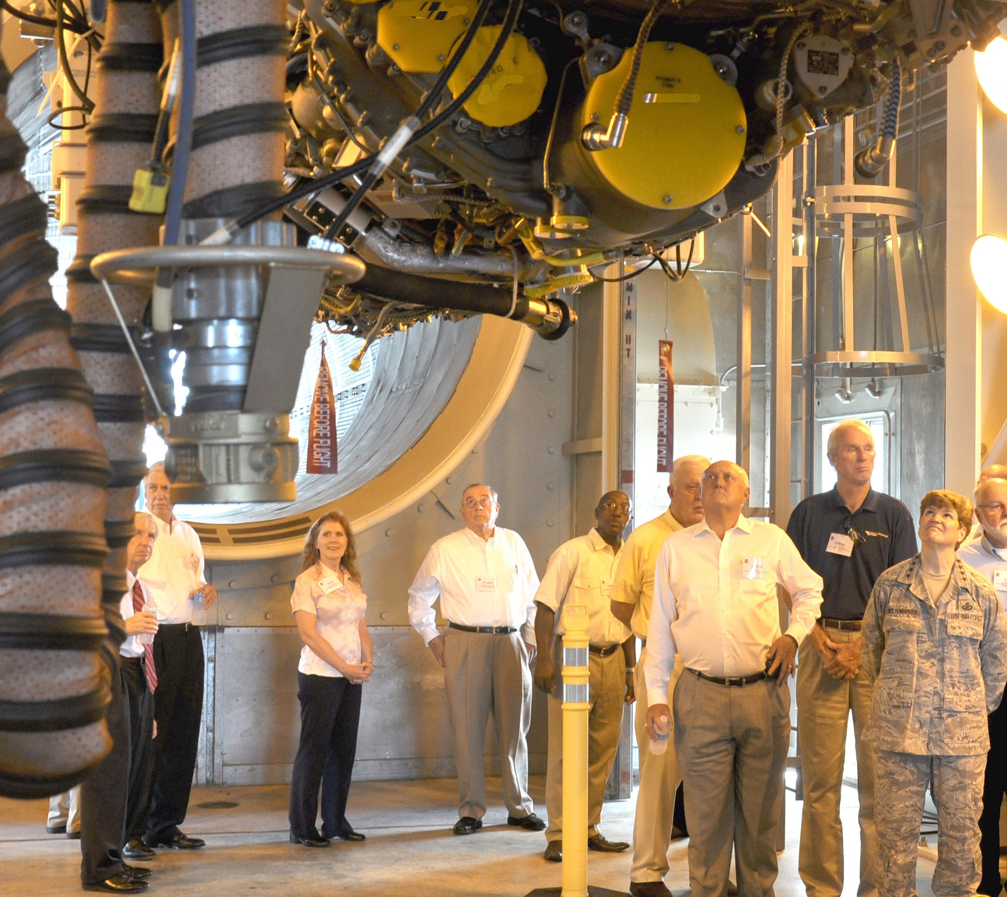 Gen. Janet Wolfenbarger, commander of Air Force Materiel Command, and members of the AFMC Community Liaison Program get an up-close look at the first U.S. Marine Corps F135 engine tested at the Oklahoma City Air Logistics Complex's new T-9 test cell facility. The general toured the test cell facility during her visit to Tinker Aug. 26.(Air Force photo by Kathy E. Paine) 