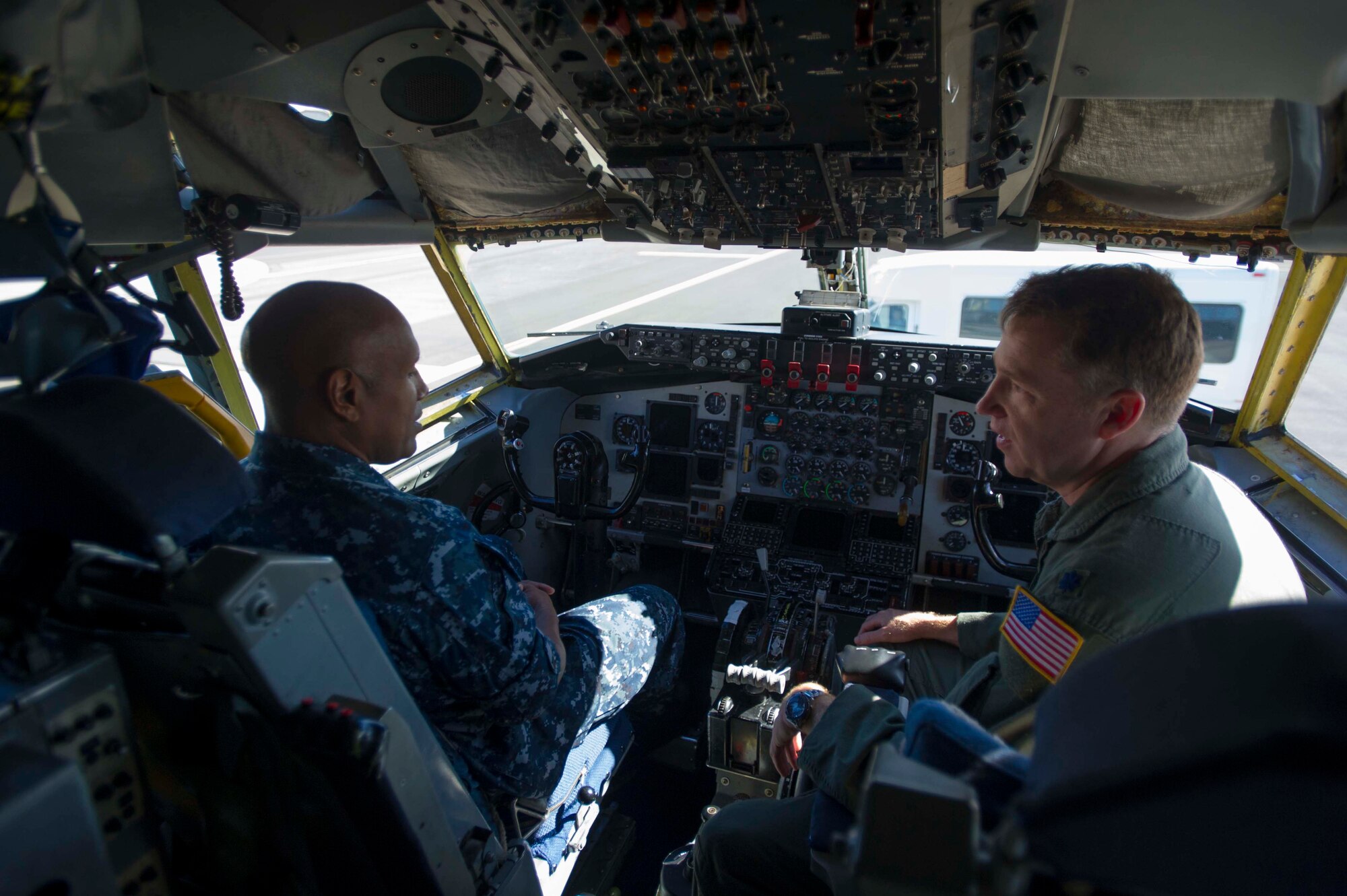 Lt. Col. Rusty Evers, 96th Air Refueling Squadron operations officer, highlights the capabilities of the KC-135 Stratotanker to Navy Capt. Stanley Keeve, Jr., Joint Base Pearl Harbor-Hickam commander, during an immersion tour on the JBPHH flightline Sept. 4, 2014. Keeve was briefed by 15th Wing leaders and visited numerous squadrons to become familiar with the wing mission and operations (U.S. Air Force photo by 1st Lt. Andrea Dykes)