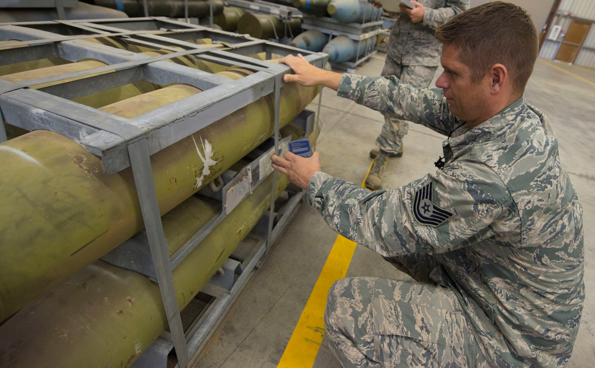 Tech. Sgt. Benjamin Fritz, 366th Equipment Maintenance Squadron assistant NCO of precision guided munitions, count munitions during the 100 percent inventory Sept. 02, 2014, at Mountain Home Air Force Base, Idaho. Airmen from different sections had the opportunity to better communicate with other Airmen and supervisors during the inventory. (U.S. Air Force Photo by Airman 1st Class Malissa Lott/RELEASED)