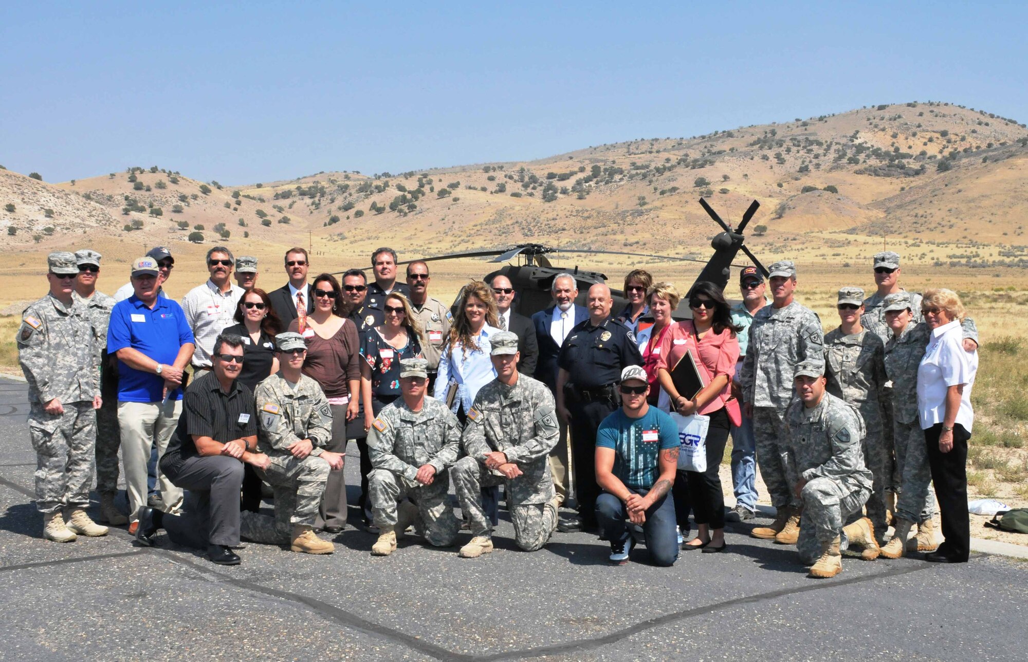 Nevada Employer Support of the Guard and Reserve representatives, civilian volunteers and Nevada National Guard Soldiers and Airmen take time for a photo in front of a Nevada Army National Guard UH-60 Blackhawk helicopter during the ESGR Lunch With the Boss event on Wednesday in Carlin. The event was held to recognize more than 20 employers from law enforcement, higher education, the mining industry, local businesses and other organizations for their outstanding support of reserve component military service members.  (NV ANG photo by Master Sgt. Suzanne Connell RELEASED)
